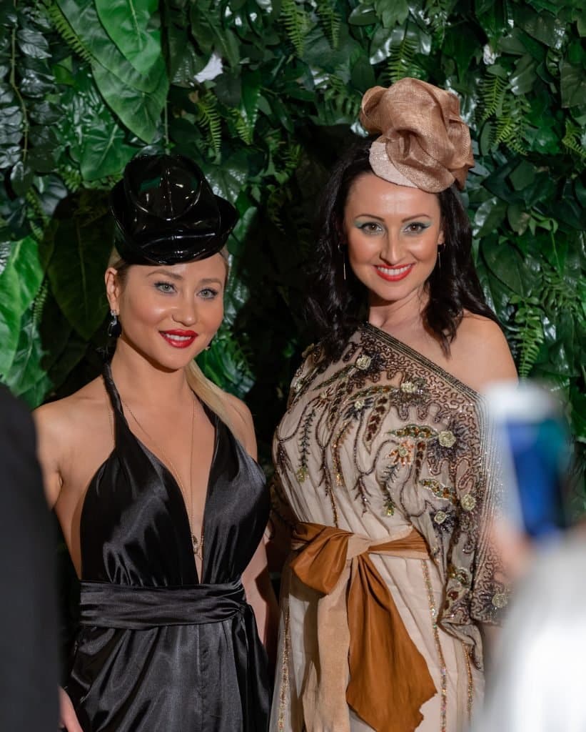 Cindy Carino and Yana Duckta both wearing Lucy Laurita and Stevens Hats